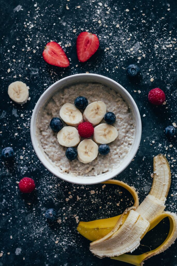 Bowl of oats topped with banana and berries